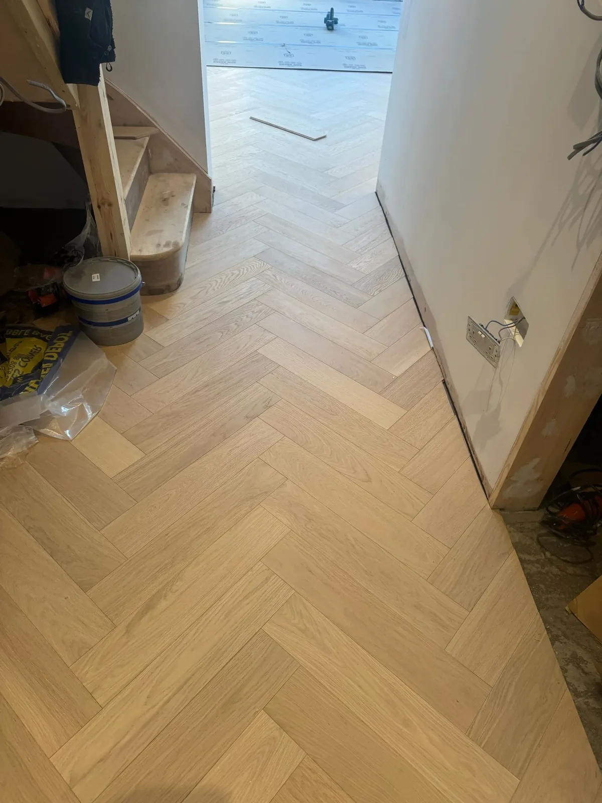 Oak staircase and herringbone floor fitted by LIGNORA